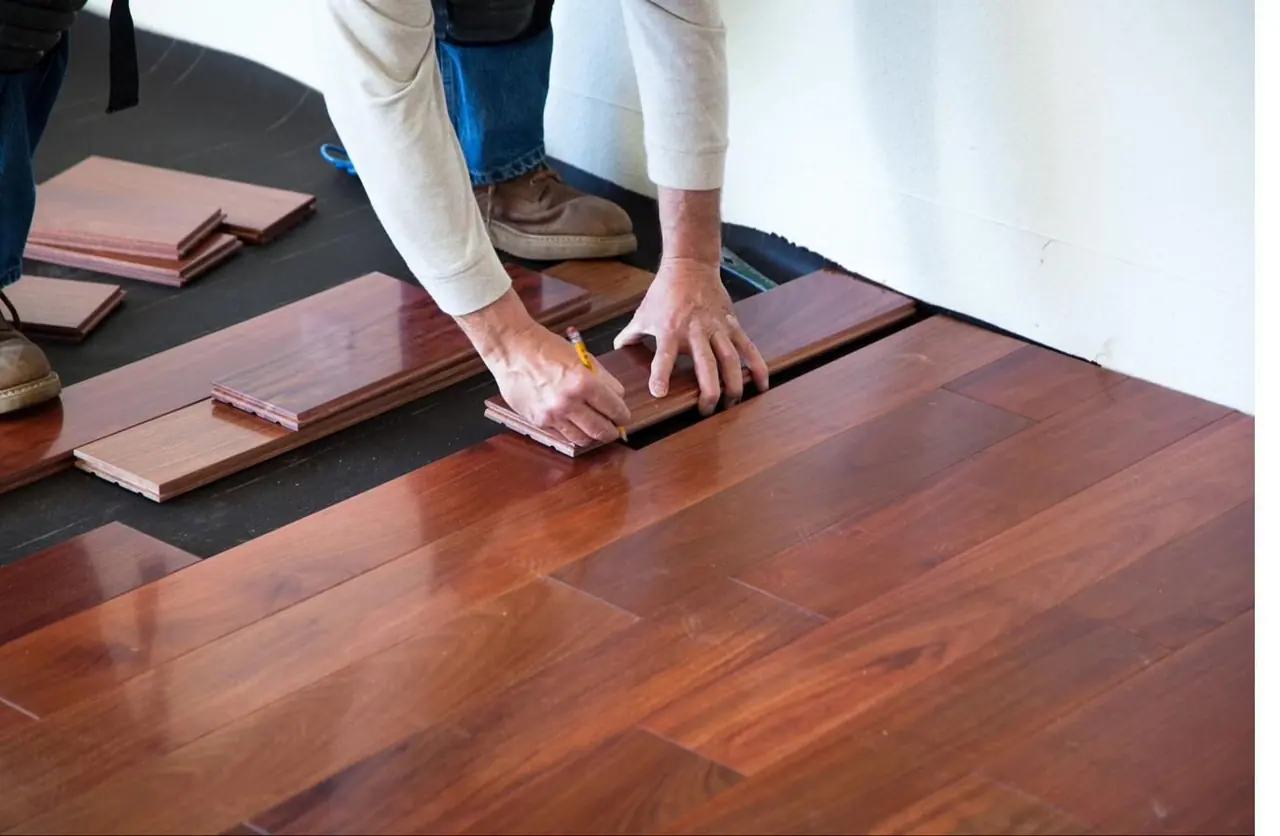 Illustration of a craftsperson marking flooring planks
